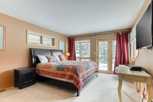 a bedroom with a bed and a window at 3 Fir Cone Lane in Sunriver