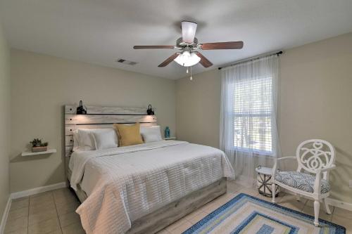 a bedroom with a bed and a ceiling fan at Galloping Seahorse - 4 Mi to NASA Space Center! in Seabrook