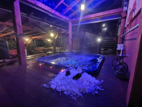 a jacuzzi tub in a house at night at Privát Adriana in Kremnica