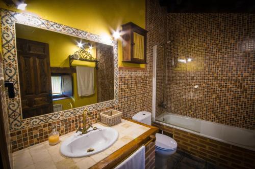 Phòng tắm tại Casa rural La Tenada