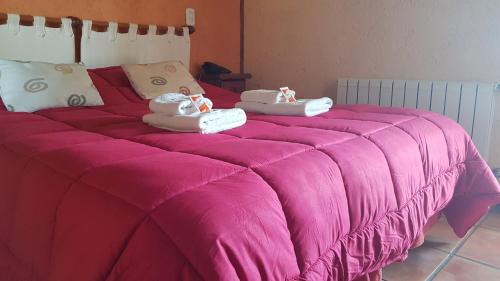 Postel nebo postele na pokoji v ubytování Fuerte Calafate Hotel Panorámico