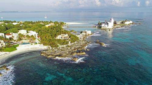 an aerial view of an island in the ocean at Hotel Playa La Media Luna in Isla Mujeres