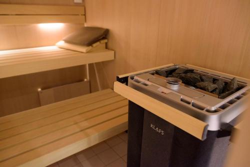 a kitchen with a stove in a room at Townhouse Maastricht & Spa in Maastricht