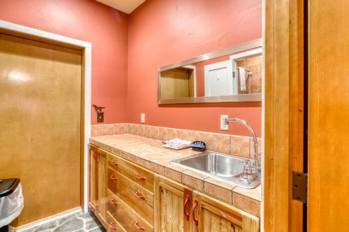 a kitchen with a sink and a mirror at Berry Glen Redwood Park Loft in Orick