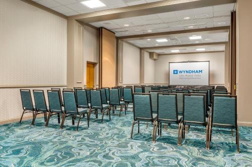 a row of chairs in a room with a screen at Wyndham Lake Buena Vista – Disney Springs® Area in Orlando