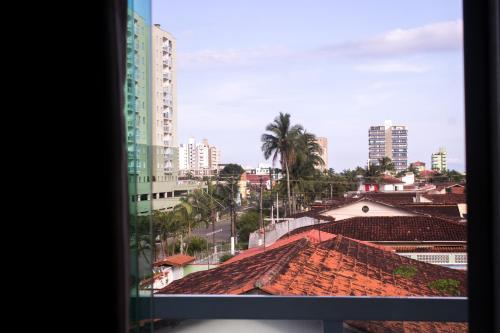 a view of a city from a window at Pousada SolMar in Caraguatatuba