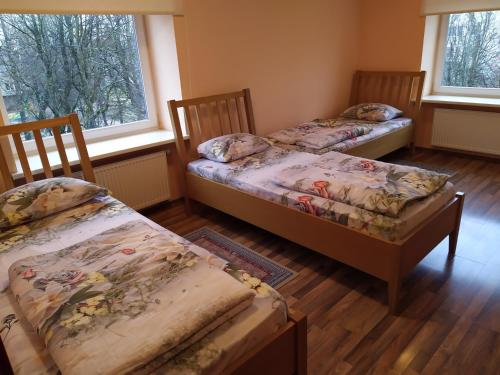 Кровать или кровати в номере Auksinė Avis
