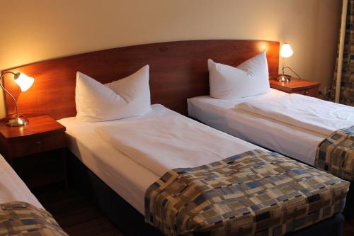 Кровать или кровати в номере City Hotel Frankfurt