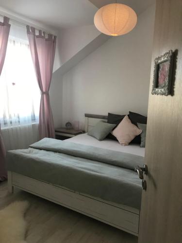 A bed or beds in a room at Apartman Harmonia Poděbrady