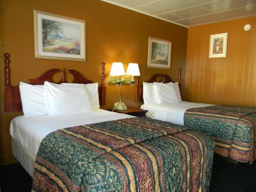 Postel nebo postele na pokoji v ubytování Fairfax Motel