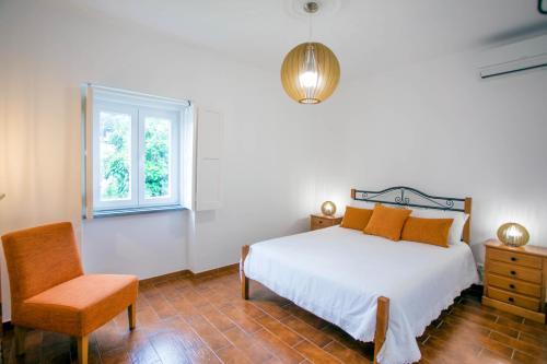 Postel nebo postele na pokoji v ubytování Casa Bom Dia