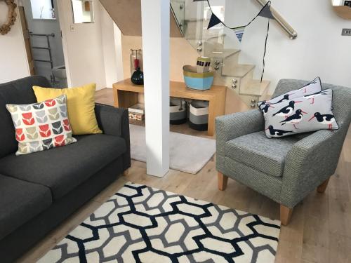a living room with two couches and a chair at Beautiful Coastal Cottage in Pittenweem in Pittenweem