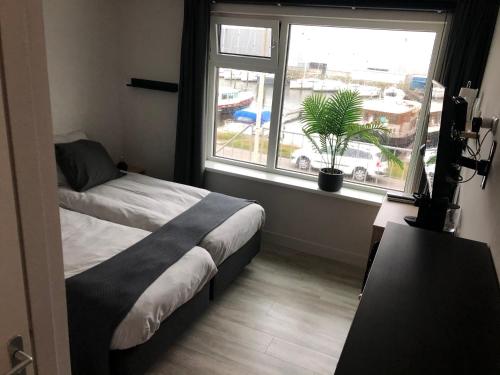 Postel nebo postele na pokoji v ubytování Marina Strand Appartement Lemmer