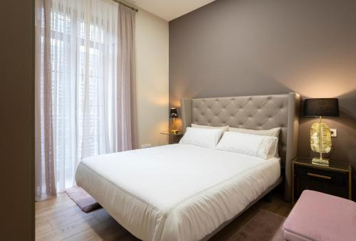Кровать или кровати в номере DE LA GUARDIA SUITE 2