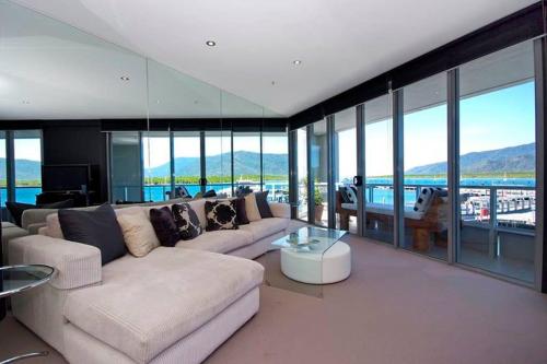a living room with a couch and a table at 301 Harbour View in Cairns