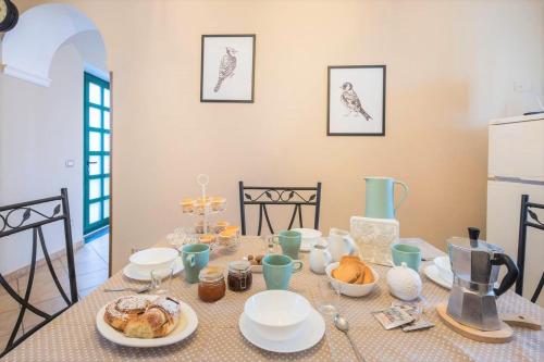 a table with a plate of food on it at Traulivi country house in Meta