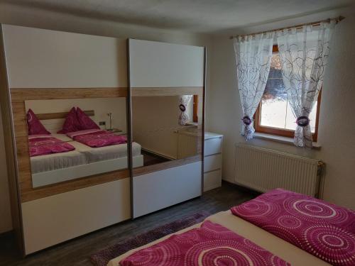 Posteľ alebo postele v izbe v ubytovaní Ferienhaus Oitzl