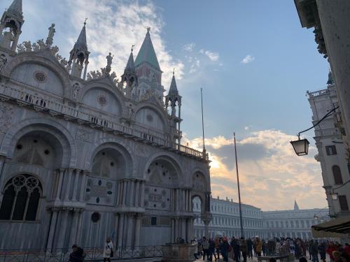 a large building with people standing in front of it at ROOFTOP TERRACE Domus dei fabbri in Venice