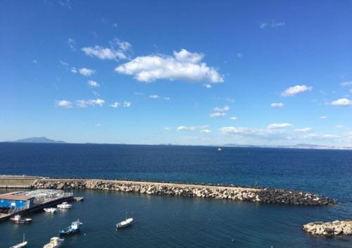 a group of boats in a body of water at Relais del mare con terrazza fronte mare free parking in Massa Lubrense