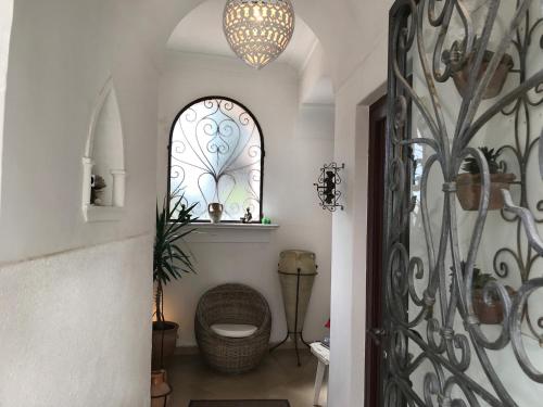 a bathroom with a toilet and a window at Casa Anna Capri Charme in Capri