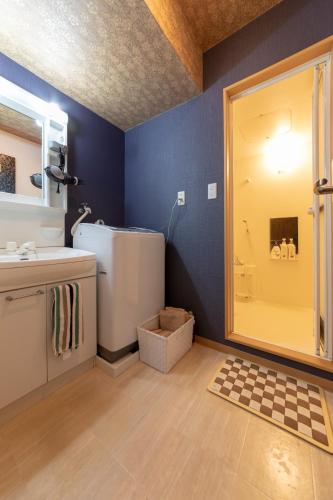 a bathroom with a shower and a sink and a toilet at Prosper 5th bldg 501 in Nagoya