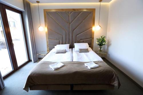 Hotel Biały Domにあるベッド