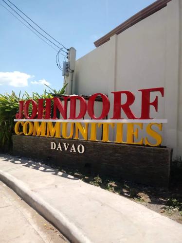 a sign on the side of a building at Eve transient home in Davao City