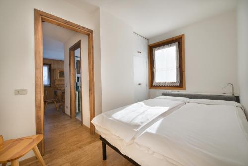 Postel nebo postele na pokoji v ubytování Appartamenti - Formula Roulette
