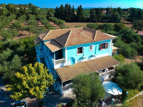 an aerial view of a blue house at Areti Orfeas Studios in Vasilikos