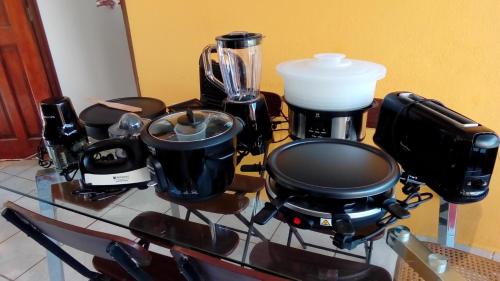 a counter with a coffee maker and a blender at Maison CÉCILIA in Port-Louis