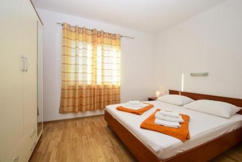 Posteľ alebo postele v izbe v ubytovaní Apartmani Jasna