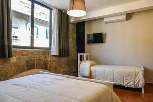 Postel nebo postele na pokoji v ubytování Gialel Pisa Guest House