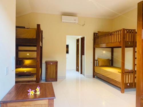 Cama o camas de una habitación en Nusa Garden Homestay
