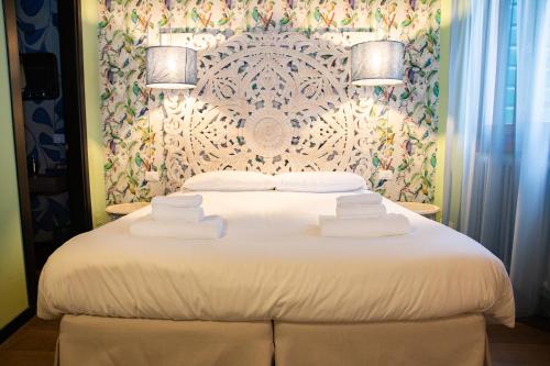 Letto o letti in una camera di Rigoletto Charm