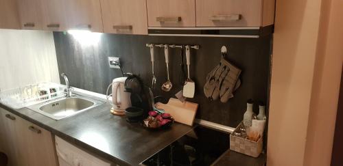 a kitchen with a sink and a counter top at Ivet Apartment in Varna City