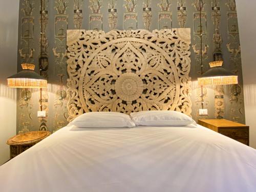 Letto o letti in una camera di Rigoletto Charm
