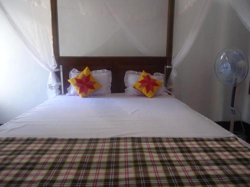 Una cama o camas en una habitación de Sanaya Homestay