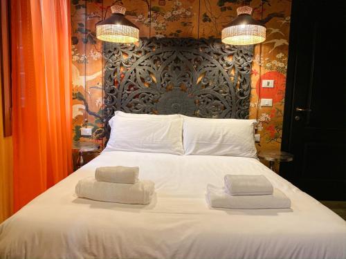 Letto o letti in una camera di Rigoletto Charm