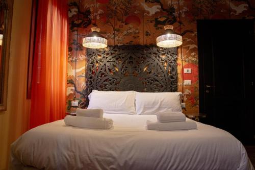 Letto o letti in una camera di Rigoletto Charm