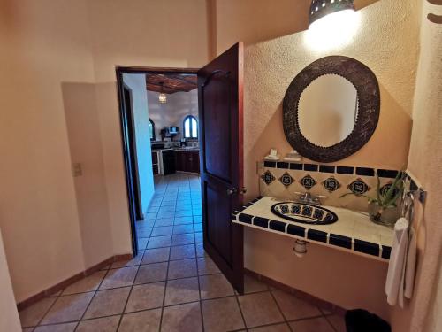 a bathroom with a sink and a mirror on the wall at Villas Vista Suites Sayulita in Sayulita