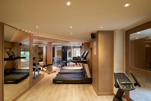 a gym with a row of treadmills and exercise equipment at Amari Vogue Krabi in Tab Kaek Beach