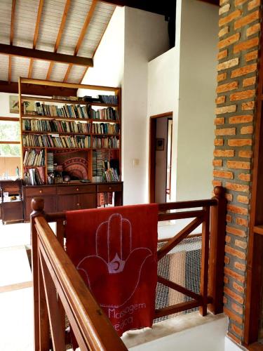 a chair with a cactus on it in a room at Toca da Capuava in Cotia