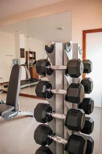 a rack of dumbbells in a gym at Best Western Cumbres Inn Cd. Cuauhtemoc in Cuauhtémoc