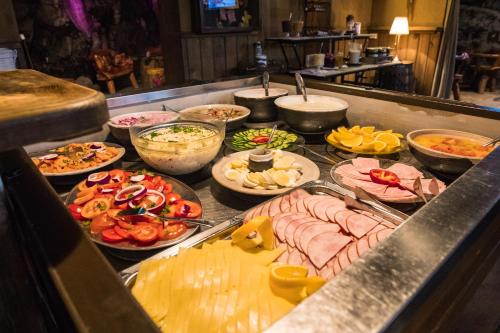 a buffet line with many different types of food at Hotel Viking in Hafnarfjördur