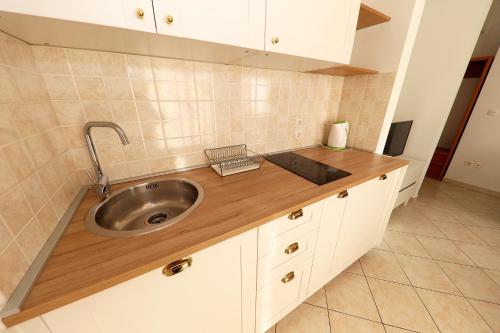 a kitchen with a sink and a counter top at Villa Sonja in Zadar