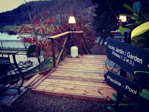 a wooden bridge with a lamp on top of it at Château Martin in Esneux