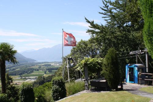 a red flag on a hill with a view at Tenuta Casa Cima - tenutacasacima com - in Gudo