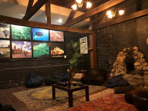 a living room with a large wall of windows at El Yarumo Hostel in Bogotá