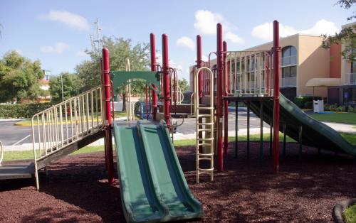a playground with a slide in a park at Westgate Towers Resort in Orlando