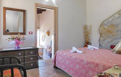 a bedroom with a bed and a dresser and a mirror at Villa Romeo - Alloggio Pastore - Private Pool in Santa Caterina dello Ionio
